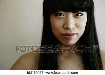 Stock Photo - Close up of smiling Japanese woman. Fotosearch