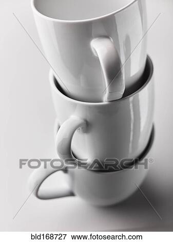 Close up of stacked white mugs View Large Photo Image Stock Photo - Close up of stacked white mugs. Fotosearch