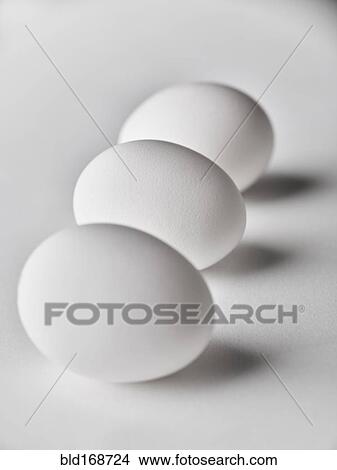 Picture - Close up of three white eggs. Fotosearch
