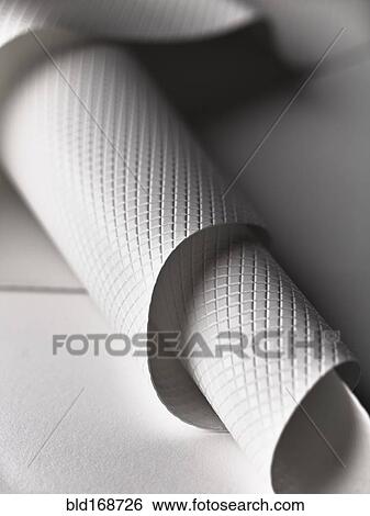 Stock Photograph - Close up of white rolled plastic sheet. Fotosearch