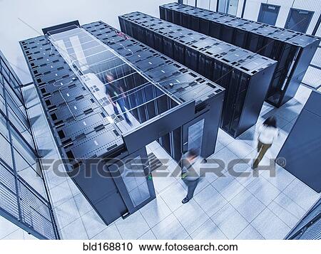 High angle view of technicians walking in server room View Large Photo Image Stock Image - High angle view of technicians walking in server room. Fotosearch