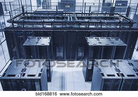 Stock Photograph - High angle view of technology in server room. Fotosearch