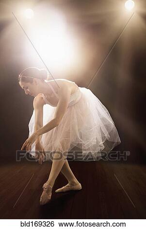Stock Photograph - Hispanic ballet dancer performing on stage. Fotosearch