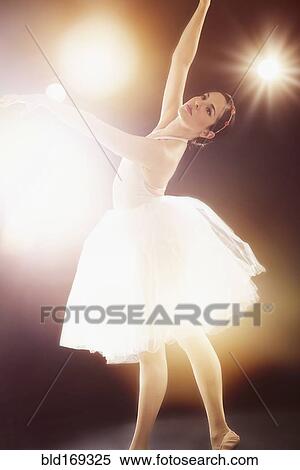Stock Photography - Hispanic ballet dancer performing on stage. Fotosearch