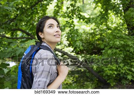 Stock Photo - Hispanic woman hiking outdoors. Fotosearch