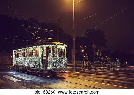 Illuminated streetcar on city street, Rome, Italy View Large Photo Image Stock Image - Illuminated streetcar on city street, Rome, Italy. Fotosearch