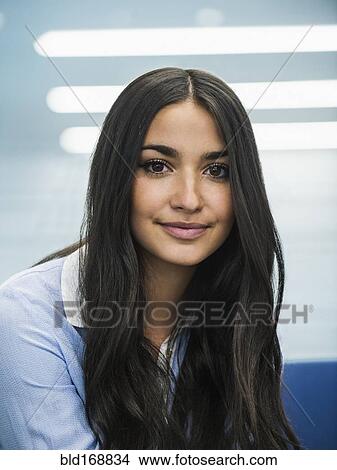 Picture - Mixed race businesswoman smiling. Fotosearch