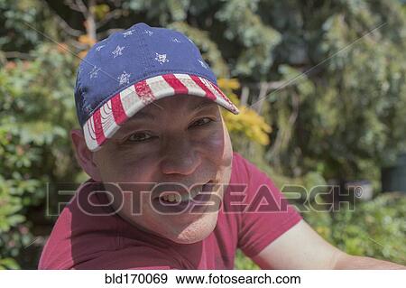 Stock Photo - Mixed race man smiling outdoors. Fotosearch