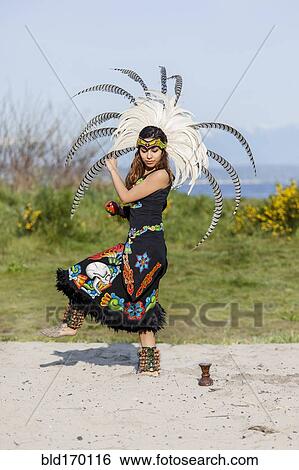 Native American woman in traditional headdress performing ceremony View Large Photo Image Stock Photograph - Native American woman in traditional headdress performing ceremony. Fotosearch