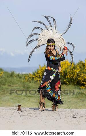 Native American woman in traditional headdress performing ceremony View Large Photo Image Stock Photography - Native American woman in traditional headdress performing ceremony. Fotosearch