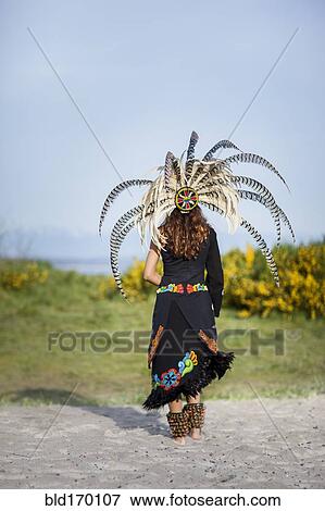 Stock Photo - Native American woman wearing traditional headdress. Fotosearch