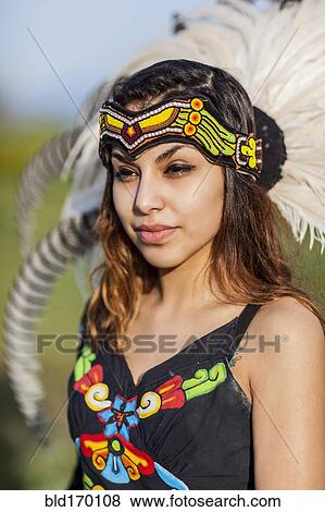 Stock Photo - Native American woman wearing traditional headdress. Fotosearch