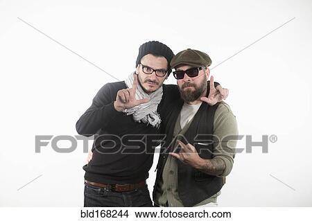 Picture - Smiling Caucasian men gesturing with fingers. Fotosearch