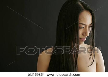 Picture - Smiling mixed race woman with long hair. Fotosearch