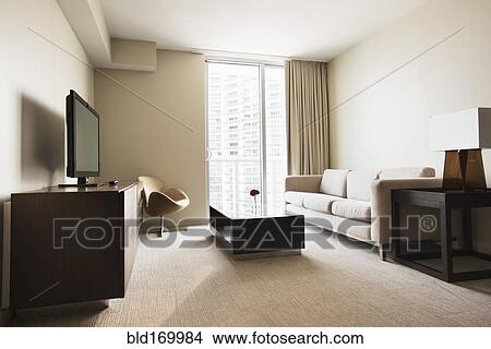 Sofa, coffee table and television in modern hotel room View Large Photo Image Picture - Sofa, coffee table and television in modern hotel room. Fotosearch