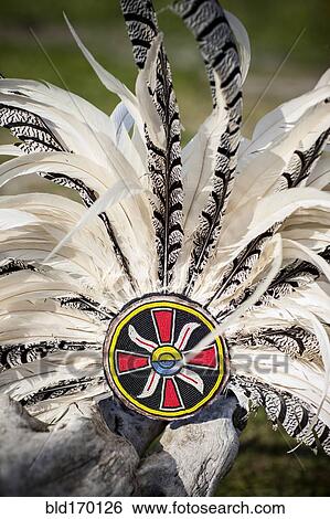 Traditional headdress on wooden log View Large Photo Image Stock Photograph - Traditional headdress on wooden log. Fotosearch