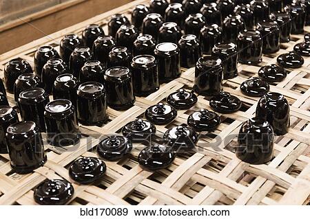 Stock Photo - Traditional lacquerware drying on rack. Fotosearch