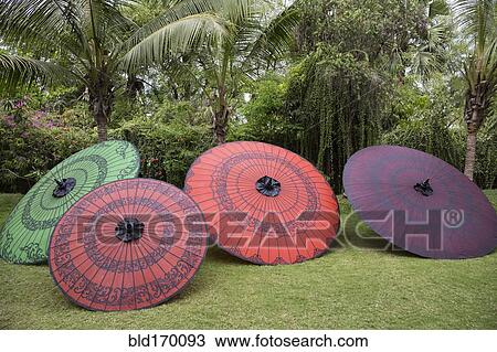 Stock Image - Traditional parasols in backyard. Fotosearch