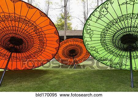 Stock Photography - Traditional parasols in backyard. Fotosearch