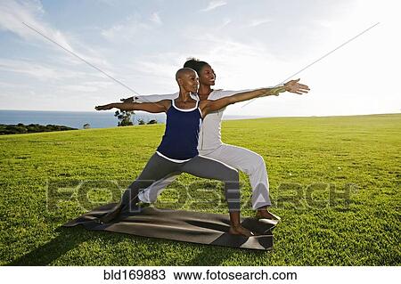 Women practicing yoga in park View Large Photo Image Stock Image - Women practicing yoga in park. Fotosearch