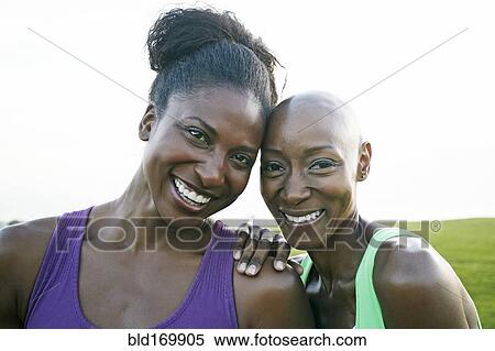 Women smiling in park View Large Photo Image Stock Photography - Women smiling in park. Fotosearch