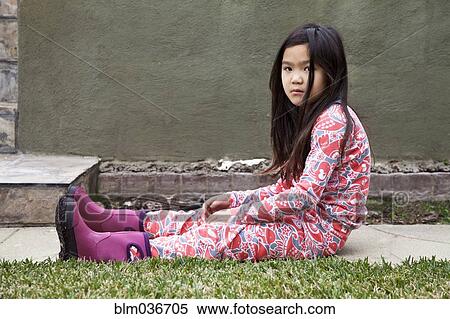 Angry mixed race girl sitting in backyard View Large Photo Image Stock Photography - Angry mixed race girl sitting in backyard. Fotosearch