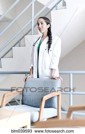 Armenian doctor standing at armchair View Large Photo Image Stock Image - Armenian doctor standing at armchair. Fotosearch
