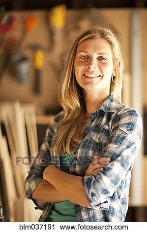 Artisan smiling in garage workshop View Large Photo Image Stock Image - Artisan smiling in garage workshop. Fotosearch