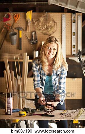Artisan working in garage workshop View Large Photo Image Stock Image - Artisan working in garage workshop. Fotosearch