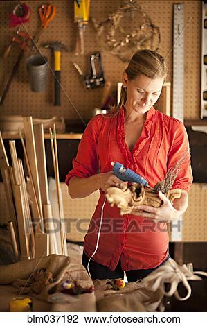 Artisan working in garage workshop View Large Photo Image Stock Image - Artisan working in garage workshop. Fotosearch