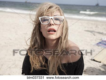 Asian woman wearing eyeglasses on beach View Large Photo Image Stock Image - Asian woman wearing eyeglasses on beach. Fotosearch