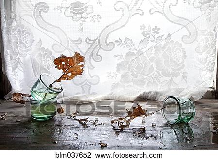 Autumn leaves in broken glass vase View Large Photo Image Stock Image - Autumn leaves in broken glass vase. Fotosearch
