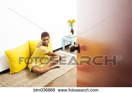 Black woman stretching on floor View Large Photo Image Stock Photograph - Black woman stretching on floor. Fotosearch