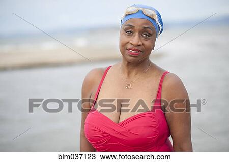 Black woman wearing swimsuit and goggles View Large Photo Image Stock Image - Black woman wearing swimsuit and goggles. Fotosearch