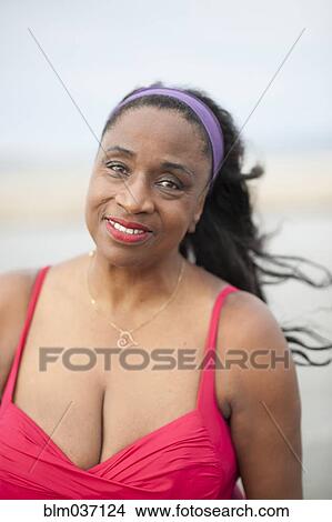 Black woman wearing swimsuit on beach View Large Photo Image Picture - Black woman wearing swimsuit on beach. Fotosearch
