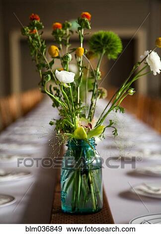 Stock Photo - Bouquet of flowers on banquet table. Fotosearch