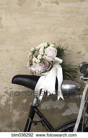 Bridal bouquet on seat of bicycle View Large Photo Image Stock Image - Bridal bouquet on seat of bicycle. Fotosearch