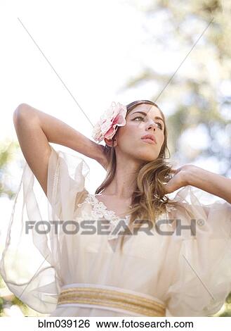 Bride walking under trees View Large Photo Image Stock Photograph - Bride walking under trees. Fotosearch