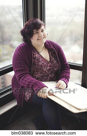 Caucasian artist holding easel in window View Large Photo Image Stock Image - Caucasian artist holding easel in window. Fotosearch