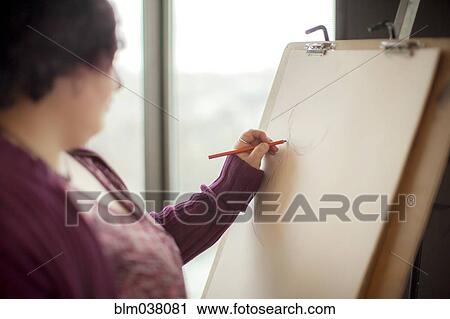 Caucasian artist sketching on easel View Large Photo Image Stock Image - Caucasian artist sketching on easel. Fotosearch