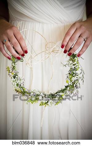 Caucasian bride holding flower headband View Large Photo Image Stock Photo - Caucasian bride holding flower headband. Fotosearch