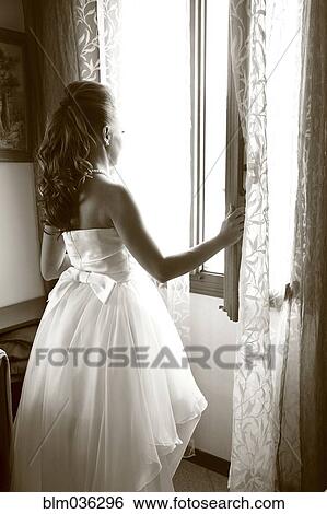 Caucasian bride looking out window View Large Photo Image Stock Photograph - Caucasian bride looking out window. Fotosearch
