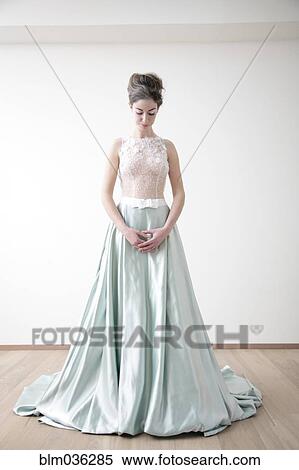 Caucasian bride standing in wedding dress View Large Photo Image Stock Photography - Caucasian bride standing in wedding dress. Fotosearch