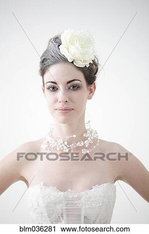 Caucasian bride wearing flower and birdcage veil View Large Photo Image Stock Image - Caucasian bride wearing flower and birdcage veil. Fotosearch