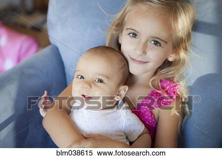 Caucasian brother and sister sitting in armchair View Large Photo Image Stock Photography - Caucasian brother and sister sitting in armchair. Fotosearch