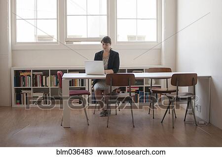 Caucasian businesswoman working on laptop in office View Large Photo Image Stock Image - Caucasian businesswoman working on laptop in office. Fotosearch