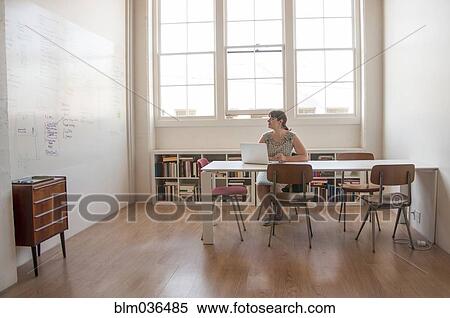 Caucasian businesswoman working on laptop in office View Large Photo Image Stock Photography - Caucasian businesswoman working on laptop in office. Fotosearch