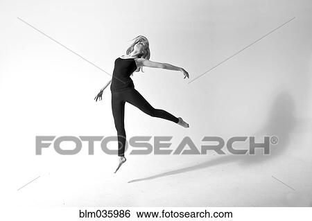 Stock Photograph - Caucasian dancer jumping for joy. Fotosearch