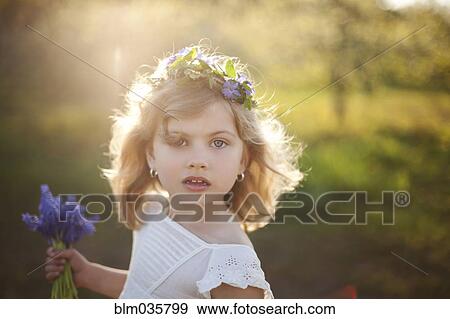 Caucasian girl carrying flowers outdoors View Large Photo Image Stock Photo - Caucasian girl carrying flowers outdoors. Fotosearch