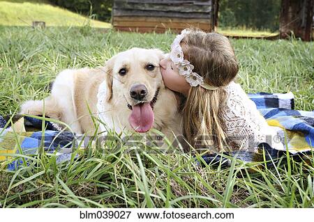 Caucasian girl laying on blanket with dog View Large Photo Image Stock Photo - Caucasian girl laying on blanket with dog. Fotosearch